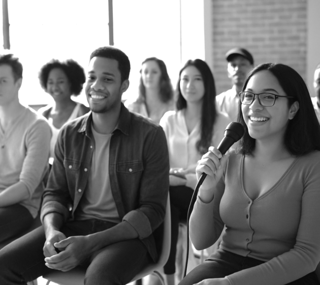 Audience laughing and engaging with a speaker